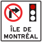 Sign with an arrow curved to the right with a red diagonal bar through it that is set above a red traffic light. The sign has a tab below it that says «Île de Montréal». This sign indicates that it is prohibited to turn right when the traffic light is