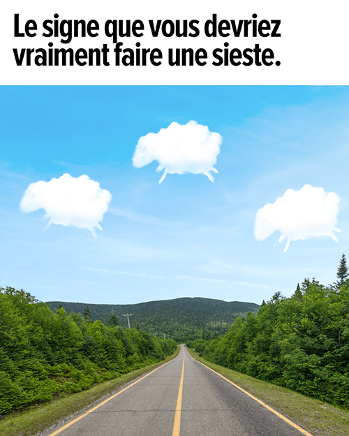 Une route avec trois nuages en forme de mouton dans le ciel. Le signe que vous devriez vraiment faire une sieste.