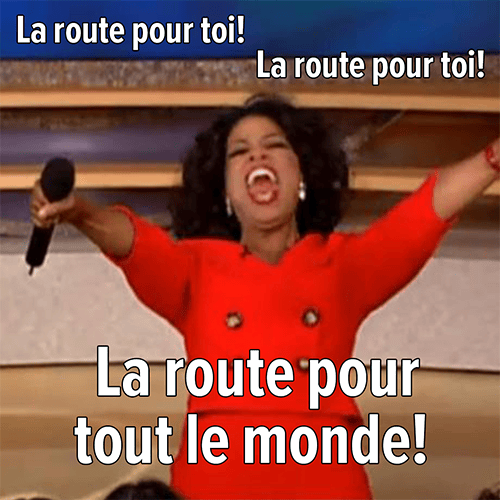 L’image montre Oprah Winfrey qui crie, les bras tendus vers le public. En surimpression est écrit : « La route pour toi! La route pour toi! La route pour tout le monde! »