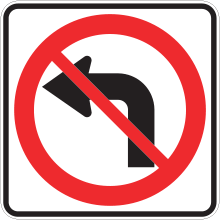 Sign with an arrow curved to the left with a red bar through it. This sign indicates that it is prohibited to turn left.